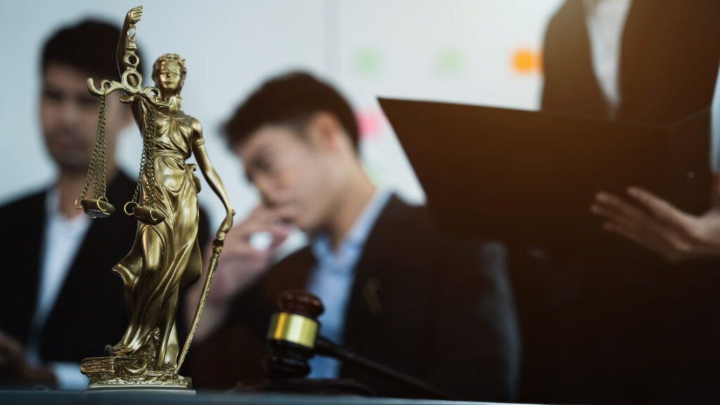 The current image has no alternative text. The file name is: statue-of-justice-with-scales-and-auction-hammer-2026-03-17-14-44-43-utc-scaled.jpg